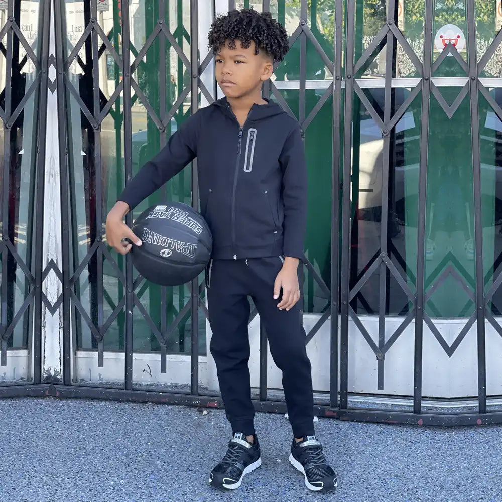 Image of a boy wearing New Balance trainers