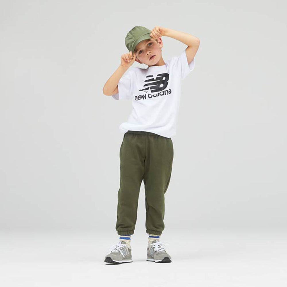 Image of a boy wearing New Balance trainers