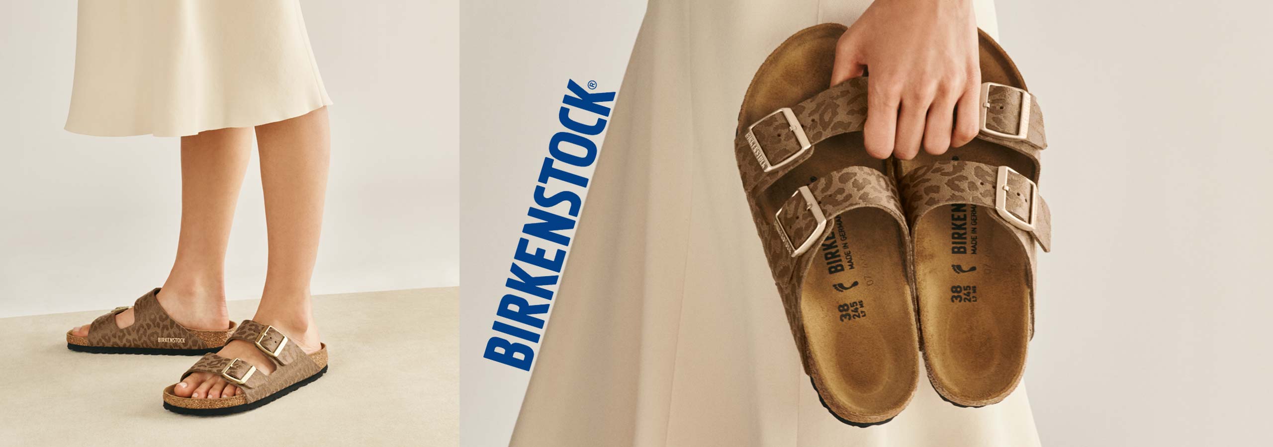 Brown Birkenstock sandals being worn with a visible 'Birkenstock' logo in the background.