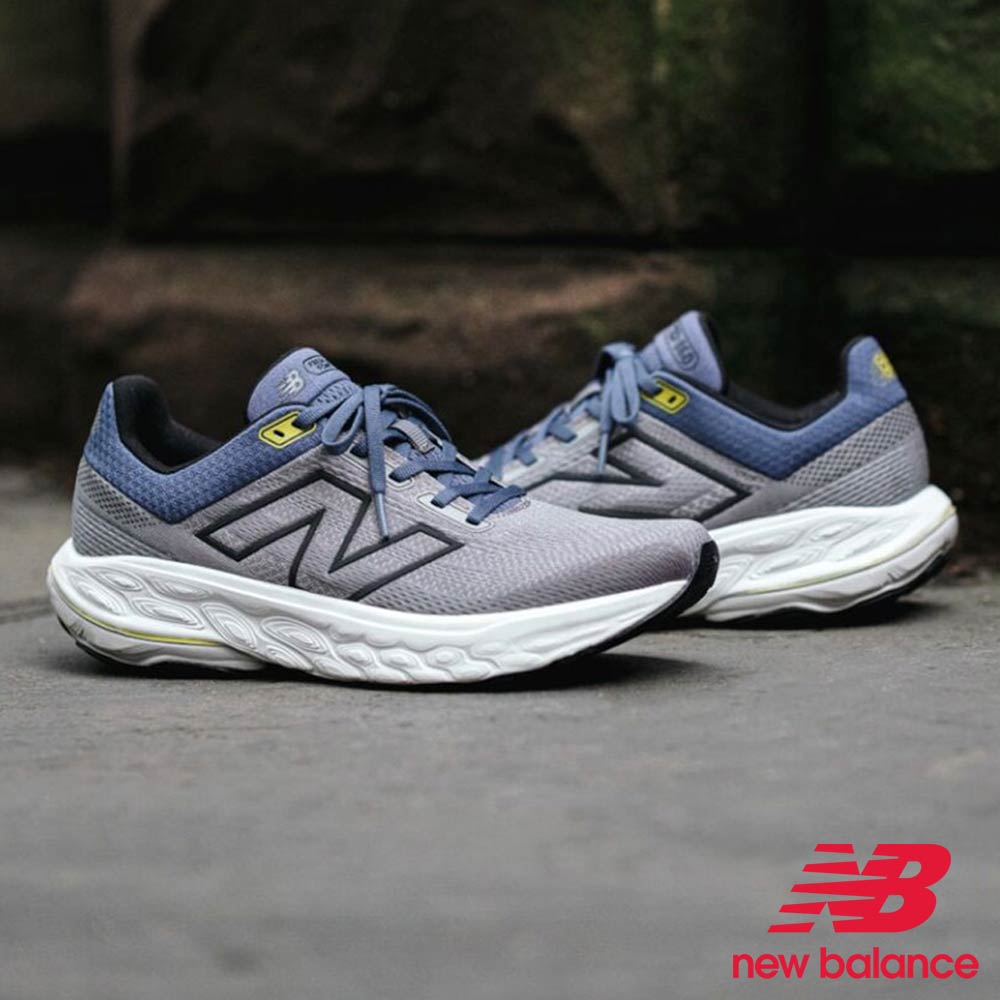 Gray and blue New Balance running shoes on a dark background